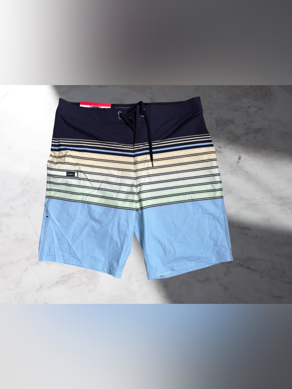 O'Neill Navy, Cream and Light Blue Striped Board Shorts Size 34